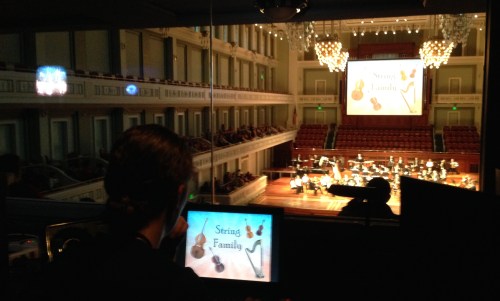 Kelley runs the powerpoint projection from the Schermerhorn light booth, March 3, 2015