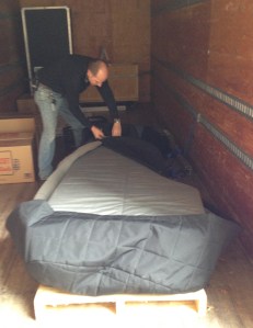 Nashville Symphony Stage Manager Paul Holt straps Anna down in the symphony truck for her ride from NSA to Schermerhorn