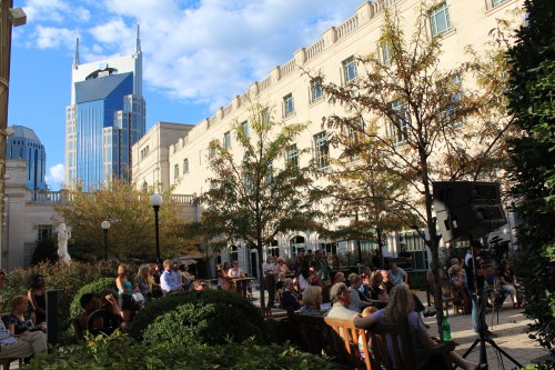 patrons enjoy music on the courtyard stage at Free Day of Music 2014