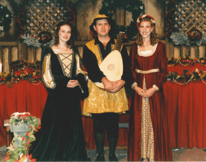 with singers at a madrigal dinner, University of South Florida, 1996